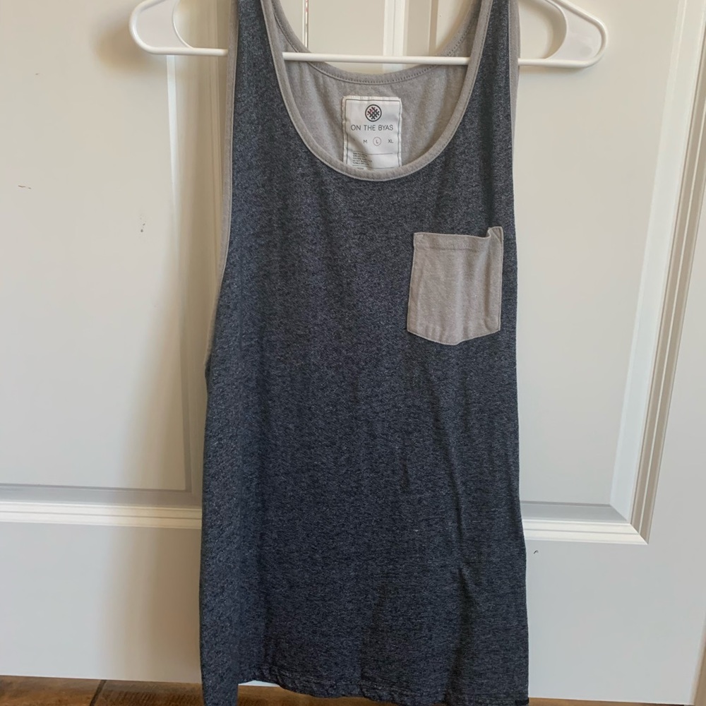 On the byas. Men’s tank.